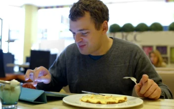 Stock Video Man Smiling As He Types In A Caf Animated Wallpaper
