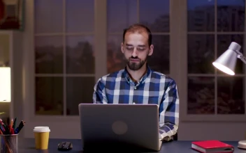 Stock Video Man Smiles While Thinking And Working From Hom Animated Wallpaper