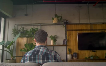 Stock Video Man Sitting On A Couch Uses Virtual Reality Glasse Animated Wallpaper