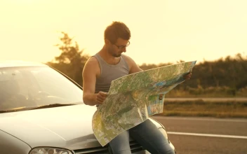 Stock Video Man Sitting In His Car Looks At A Map O Animated Wallpaper