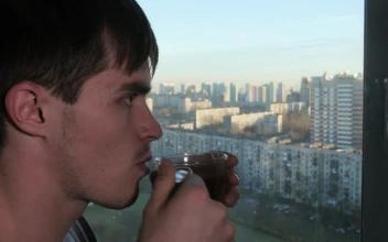 Stock Video Man Sipping Tea By The Windo Animated Wallpaper