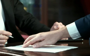 Stock Video Man Signing Off A Contract And Handshak Animated Wallpaper