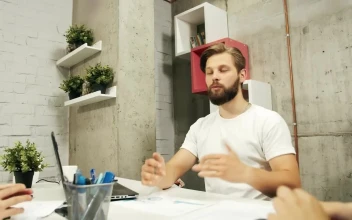Stock Video Man Shares Idea With Creative Team At Meetin Animated Wallpaper