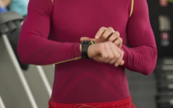 Stock Video Man Sets Timer On Smartwatch Before Gym Workou Animated Wallpaper