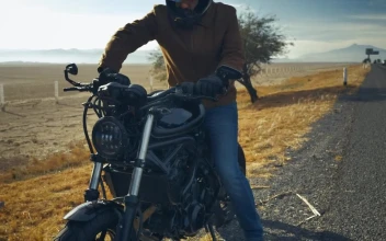 Stock Video Man Riding His Motorcycle On The Side Of A Roa Animated Wallpaper