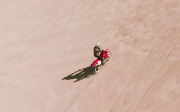 Stock Video Man Riding A Motorcycle In The Deser Animated Wallpaper