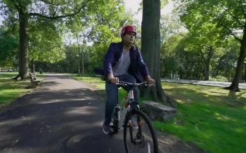Stock Video Man Riding A Bike Through The Par Animated Wallpaper