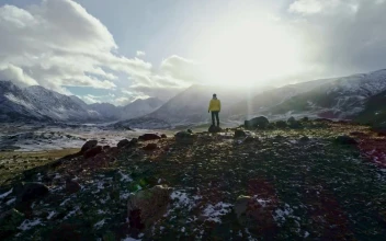 Stock Video Man Raising His Hands On Top Of A Cliff A Animated Wallpaper