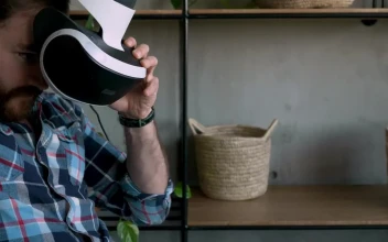 Stock Video Man Puts On Virtual Reality Glasse Animated Wallpaper