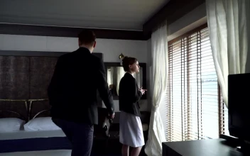 Stock Video Man Puts Luggage On Bed And Looks Out Window O Animated Wallpaper