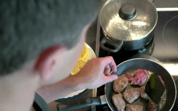 Stock Video Man Preparing Beef In A Frying Pa Animated Wallpaper