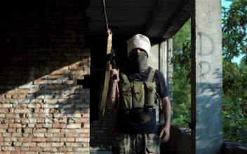 Stock Video Man Posing With A Gun On An Abandoned Sit Animated Wallpaper