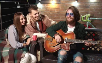 Stock Video Man Plays Guitar For Friends On Relaxing Evenin Animated Wallpaper
