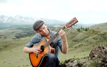 Stock Video Man Plays Acoustic Guitar On Ridge Above Mountain Landscap Animated Wallpaper