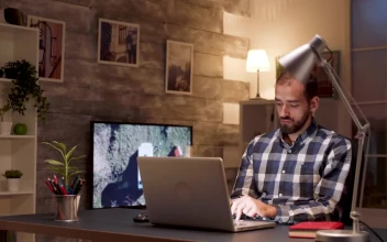 Stock Video Man Pauses To Think While Working On Lapto Animated Wallpaper