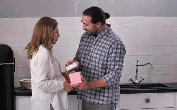 Stock Video Man Opening A Gift From His Wif Animated Wallpaper