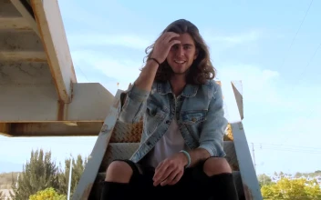 Stock Video Man On Stairs Of Graffitied Buildin Animated Wallpaper