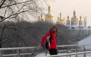 Stock Video Man On A Bridge In A Snowy Cit Animated Wallpaper