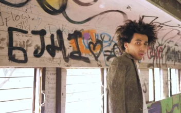 Stock Video Man Modeling In Graffitied Tunne Animated Wallpaper