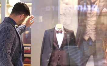 Stock Video Man Looking At The Sideboard Of A Suit Stor Animated Wallpaper