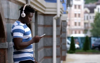Stock Video Man Listening To Music On His Phon Animated Wallpaper