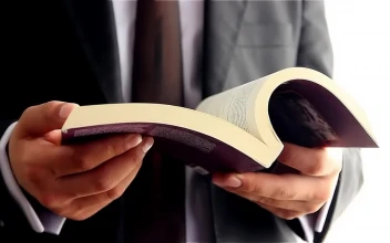 Stock Video Man Leafing Through A Book Looking For A Pag Animated Wallpaper