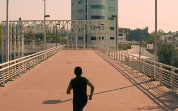 Stock Video Man Jogging On A Pedestrian Bridge In The Cit Animated Wallpaper