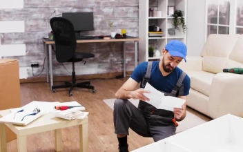 Stock Video Man Is Confused By Instructions For Furniture Assembl Animated Wallpaper