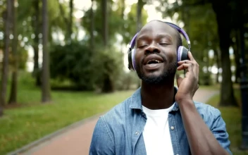 Stock Video Man Inspired By Music While On Walk In Par Animated Wallpaper