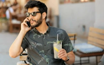 Stock Video Man In Sunglasses Talks On Mobile Holding Lemonad Animated Wallpaper