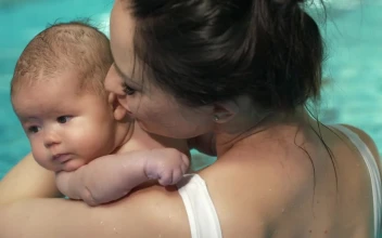 Stock Video Mother With Her Little Baby In A Swimming Pool