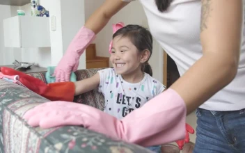 Stock Video Mother With Her Little Daughter Cleaning An Armchair