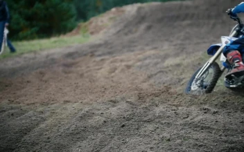 Stock Video Motocross Racer Moving Up A Dirt Hill