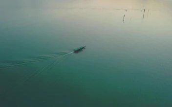 Stock Video Motorboat On A Large Lake With Turquoise Blue Waters Large