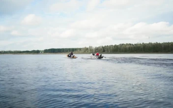 Stock Video Motorboat And Jet Ski Sailing On A Lake
