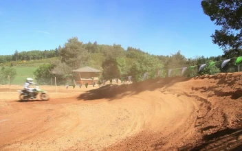 Stock Video Motorcross Rider Kicking Up Dirt