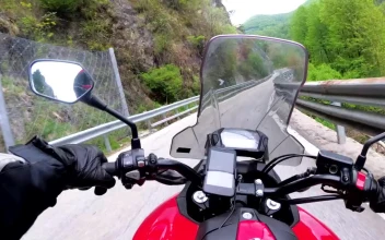 Stock Video Motorcycle Driving In The Countryside