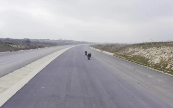 Stock Video Motorcycles Racing Down A Road