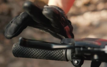 Stock Video Motorcyclist Placing His Hands On The Handlebars