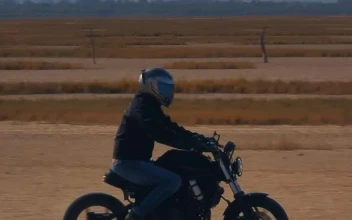 Stock Video Motorcyclist Speeding Through A Desert