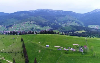 Stock Video Mountain Village Down The Mountains Aerial View