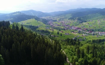 Stock Video Mountain Village Seen From Afar Aerial