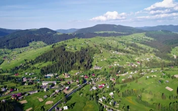 Stock Video Mountain Village Seen From The Air At A Sunny Day