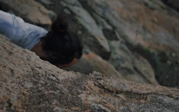 Stock Video Mountaineer Climbing A Rocky Hill