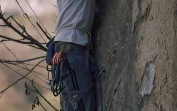 Stock Video Mountaineer Climbing A Rocky Vertical Mountain