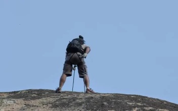 Stock Video Mountaineer Descending A Rocky Slope