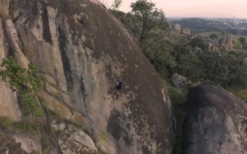 Stock Video Mountaineer Going Down A Mountain