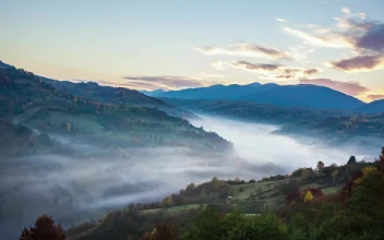 Stock Video Mountainous Valley During Sunrise Time Lapse