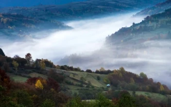Stock Video Mountainous Valley With Fog During Sunrise