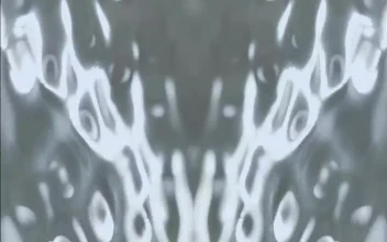 Stock Video Movement Of Water While Vibrating Mirror Effect